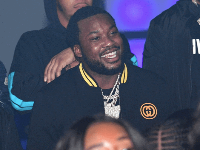 meek mill with a smile on his face