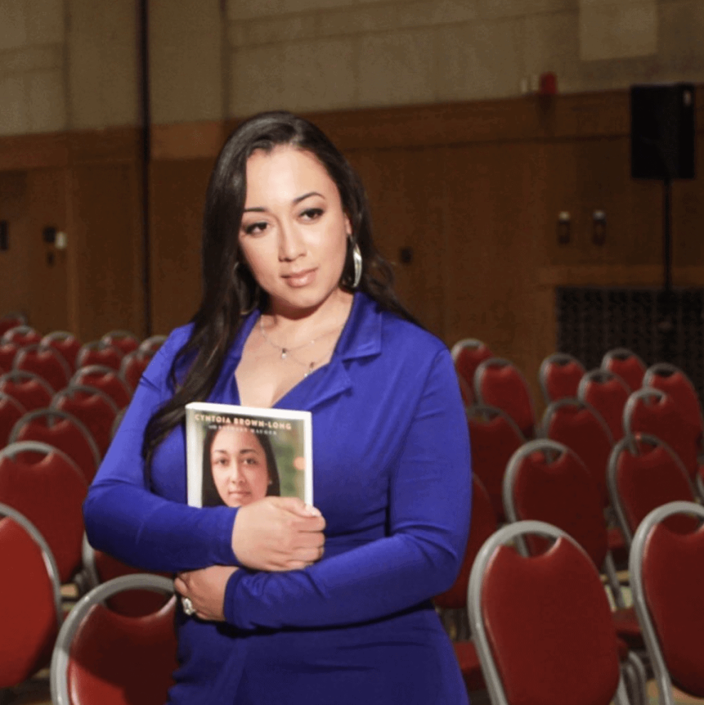 Cyntoia Brown holding her book 'Free Cyntoia'