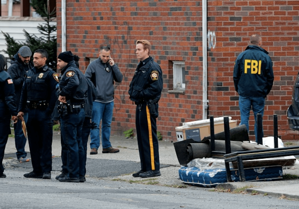 FBI officers and New Jersey police officers walk outside of suspect Sayfullo Saipov's apartment on November 1