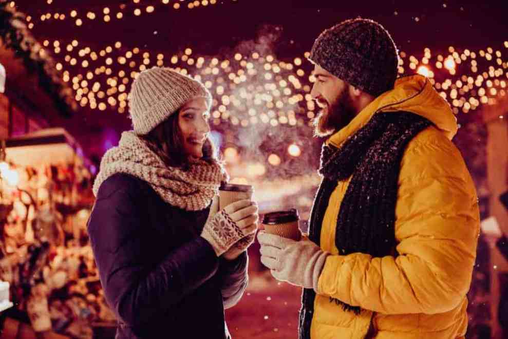A couple in the winter drinking coffee