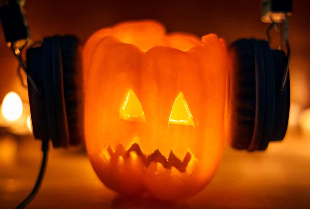 Scary Pumpkin wearing headphones