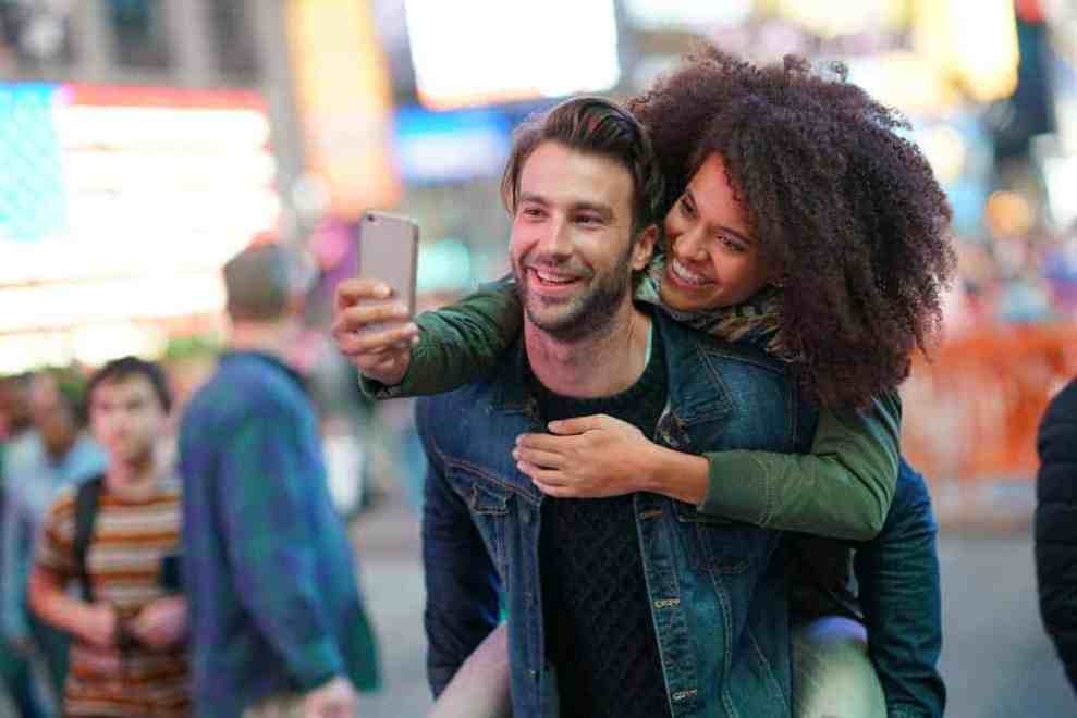 A couple in NYC taking a selfie