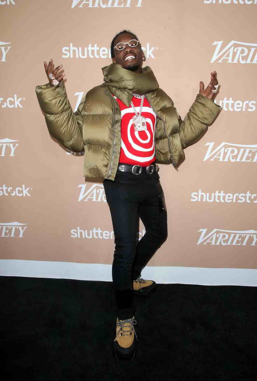 Offset wearing a green coat