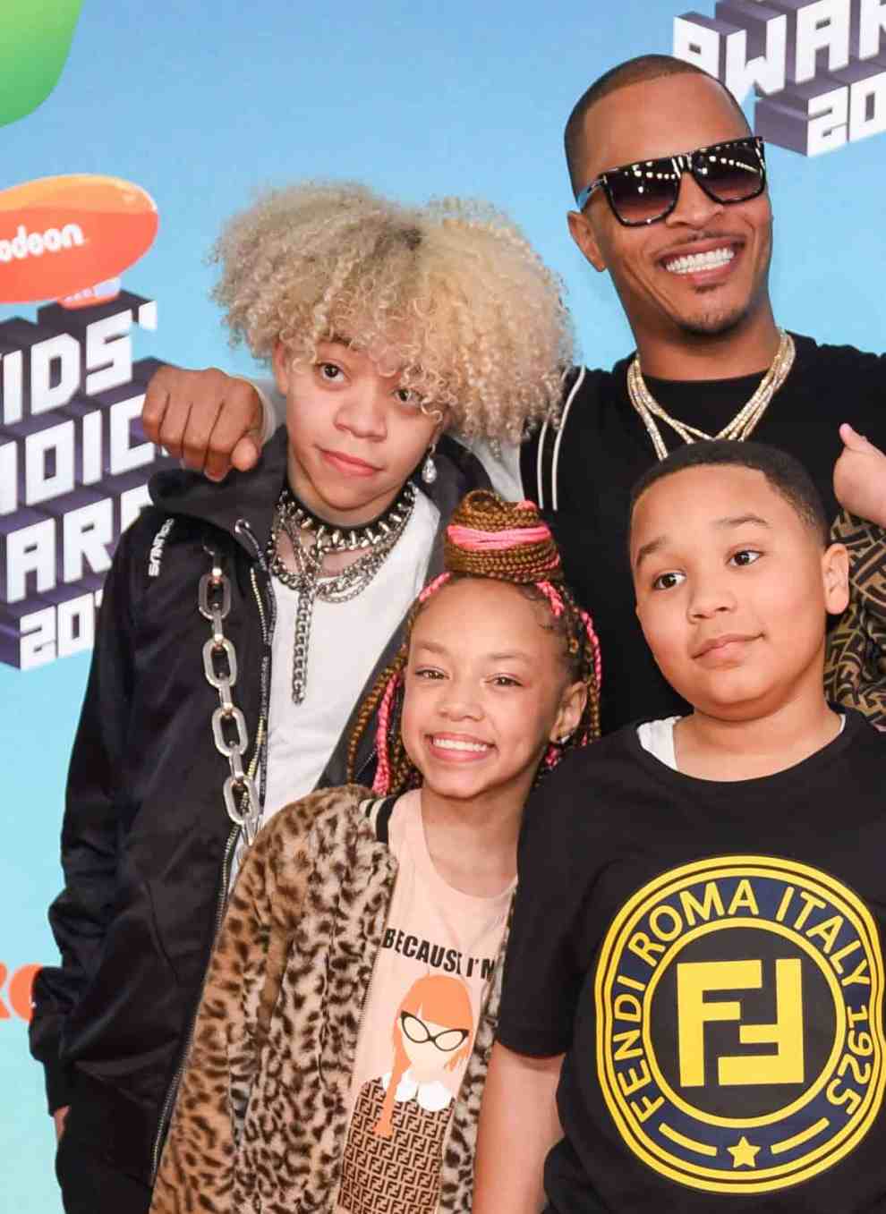 LOS ANGELES, CALIFORNIA - MARCH 23: T.I. (C), wife singer-songwriter Tiny (R) and their children (from L) Clifford 'King' Joseph Harris III, Layah Amore Harris, Major Philant Harris and Heiress Diana Harris attend Nickelodeon's 2019 Kids' Choice Awards at Galen Center on March 23, 2019 in Los Angeles, California.