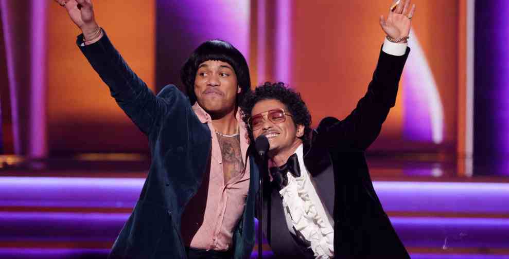 LAS VEGAS, NEVADA - APRIL 03: (L-R) Anderson .Paak and Bruno Mars of Silk Sonic accept the Record Of The Year award for ‘Leave The Door Open’ onstage during the 64th Annual GRAMMY Awards at MGM Grand Garden Arena on April 03, 2022 in Las Vegas, Nevada.