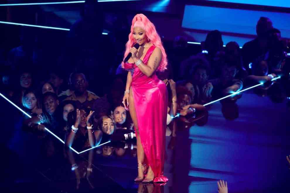 NEWARK, NEW JERSEY - AUGUST 28: Nicki Minaj speaks onstage at the 2022 MTV VMAs at Prudential Center on August 28, 2022 in Newark, New Jersey. (Photo by Arturo Holmes/Getty Images)