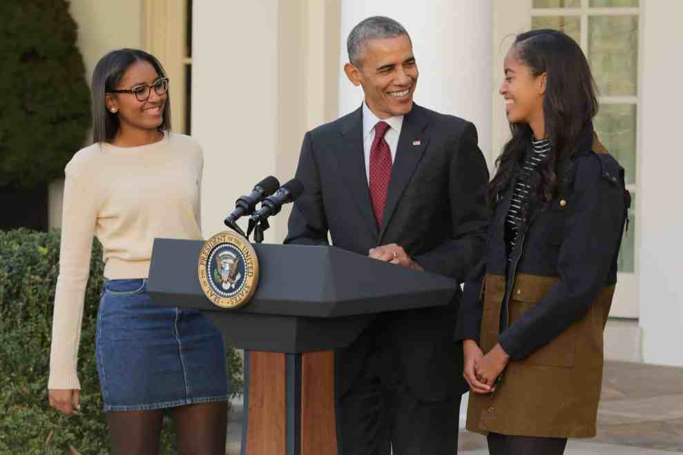 WASHINGTON, DC - NOVEMBER 25: U.S. President Barack Obama delivers remarks with his daughters Sasha (L) and Malia during the annual turkey pardoning ceremony in the Rose Garden at the White House November 25, 2015 in Washington, DC. In a tradition dating back to 1947, the president pardons a turkey, sparing the tom -- and his alternate -- from becoming a Thanksgiving Day feast. This year, Americans were asked to choose which of two turkeys would be pardoned and to cast their votes on Twitter.