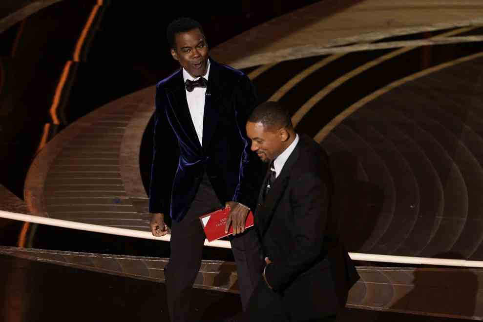 HOLLYWOOD, CALIFORNIA - MARCH 27: (L-R) Chris Rock and Will Smith are seen onstage during the 94th Annual Academy Awards at Dolby Theatre on March 27, 2022 in Hollywood, California.