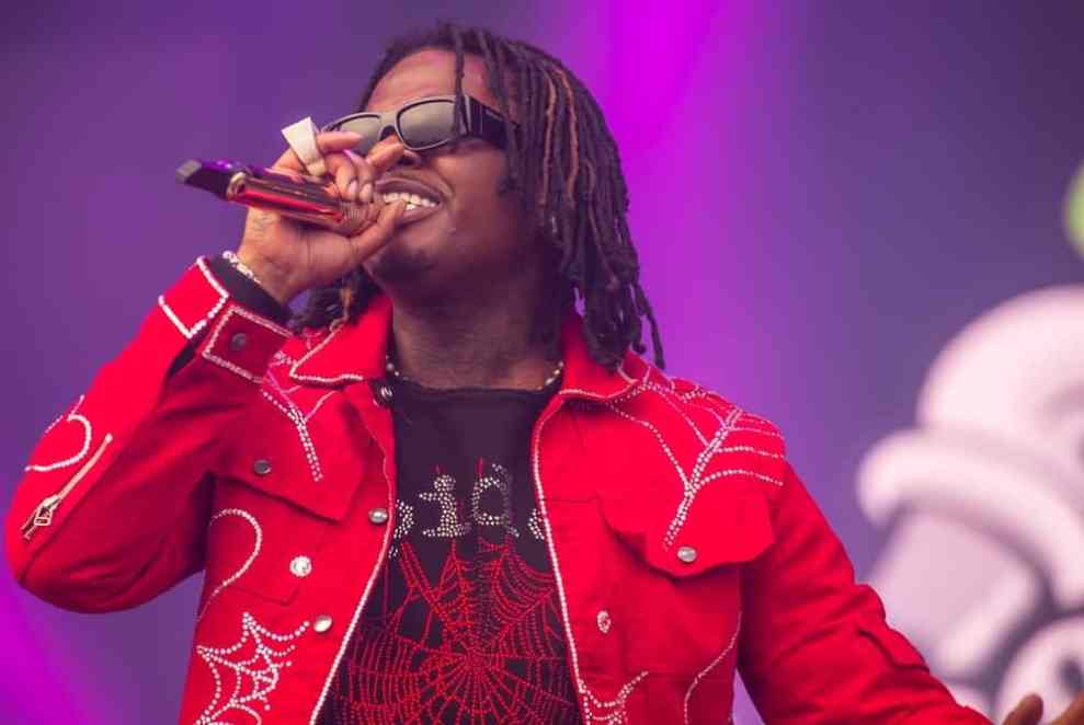 Gunna with a mic on stage performing