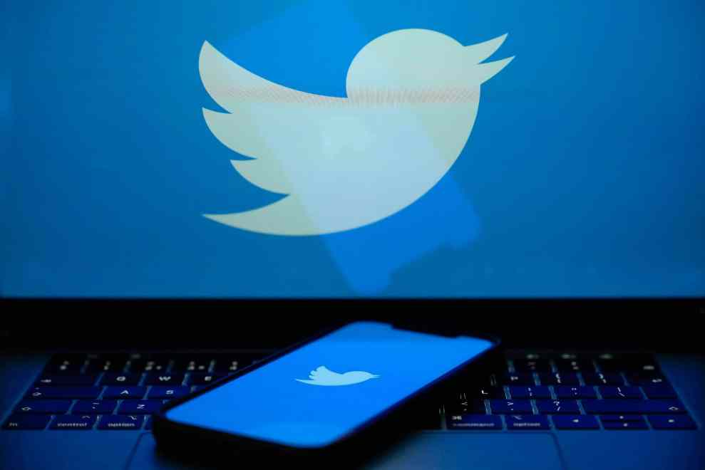 KNUTSFORD, UNITED KINGDOM APRIL 21: In this photo illustration the Twitter logo is seen on a computer screen and mobile cellphone on April 21, 2023 in Knutsford, United Kingdom. The social media company started removing large numbers of the blue verification check marks, or "blue ticks," that had historically indicated a verified account. The company said in a statement that they are "removing legacy verified checkmarks" and, to remain verified on Twitter, users can sign up for the paid Twitter Blue subscription.