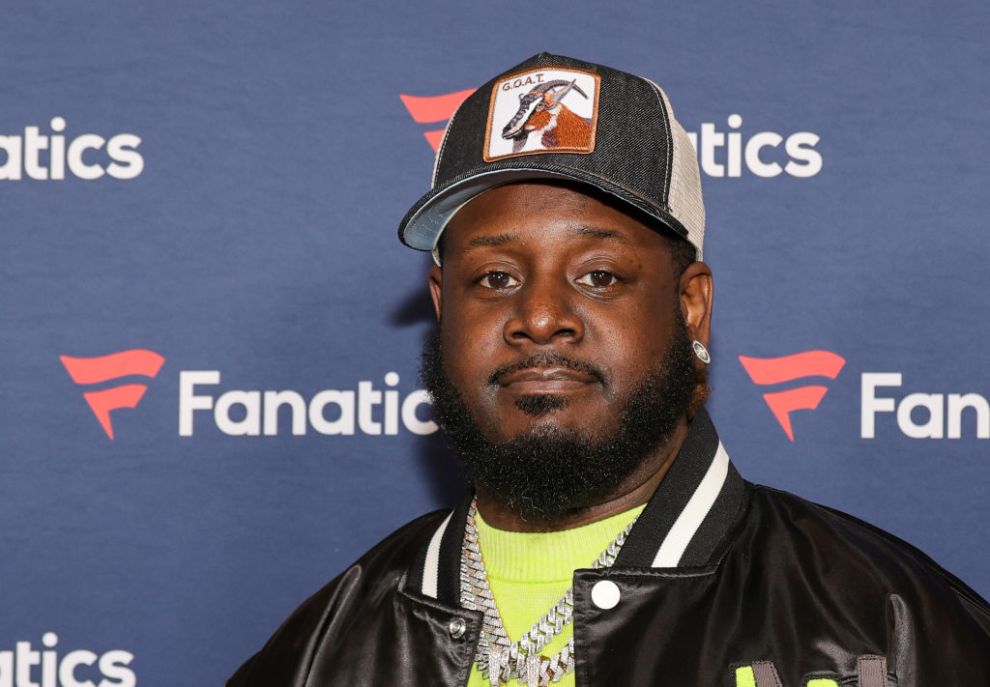 T-Pain With A Grey Hat On frowning at the camera
