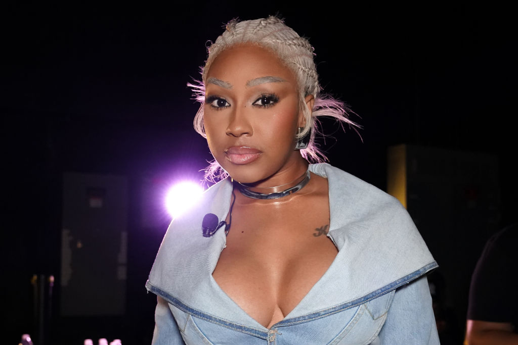 Yung Miami Asked To Autograph A Baby Oil Bottle