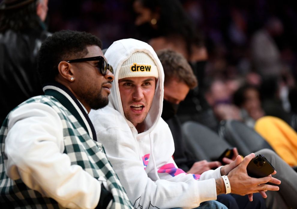 Justin Bieber and Usher attend the game between the Los Angeles Lakers and the Golden State Warriors at Staples Center on October 19, 2021 in Los Angeles, California. NOTE TO USER: User expressly acknowledges and agrees that, by downloading and/or using this Photograph, user is consenting to the terms and conditions of the Getty Images License Agreement.